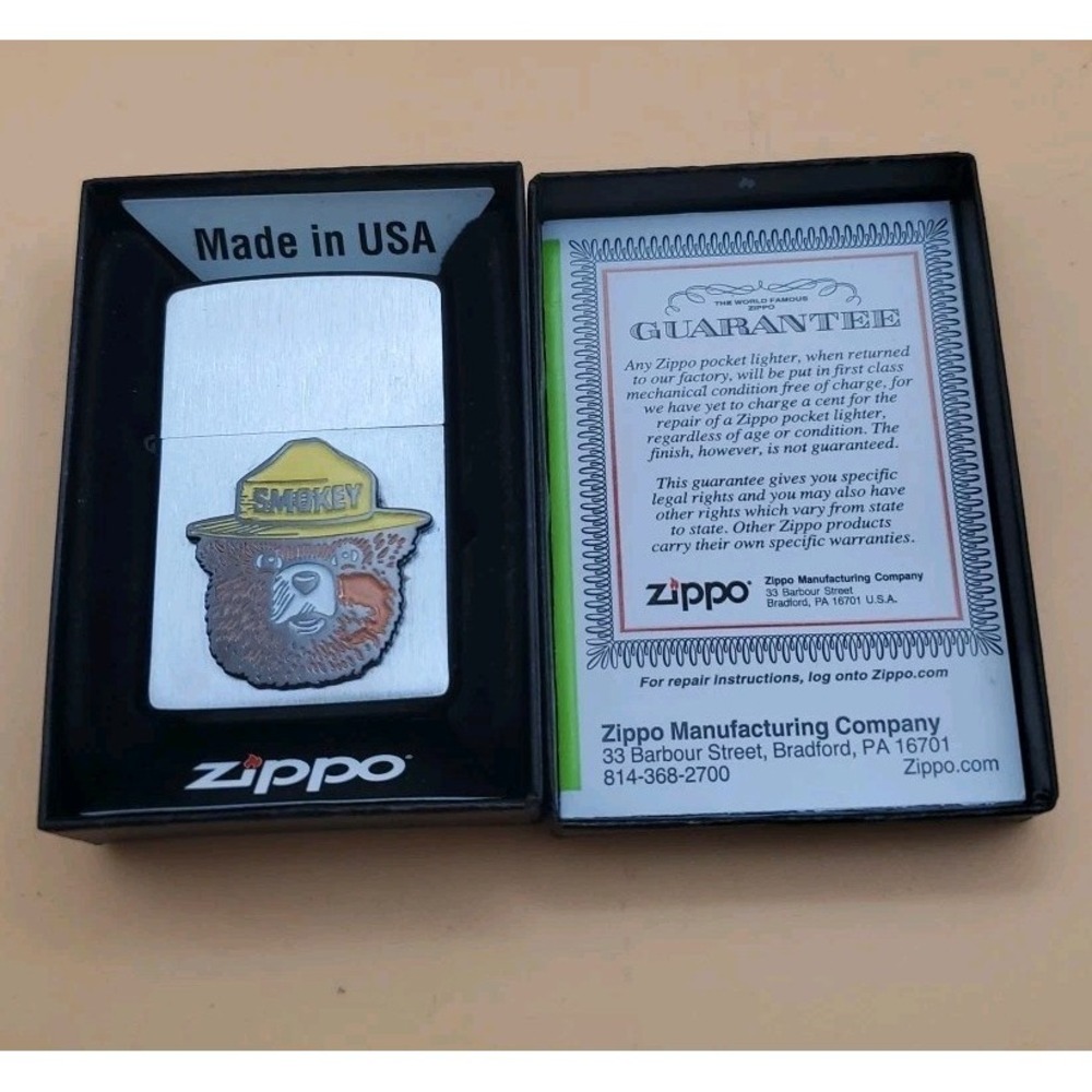 Zippo Lighter With A Smokey The Bear Medallion Silver And Black,  Unused